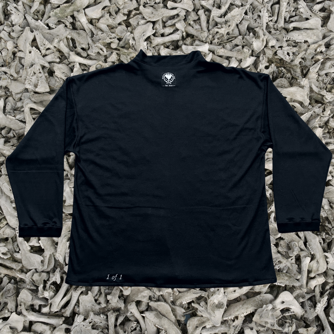 Unapologetic Youth long sleeve shirt featuring a bones graphic design, displayed on a white background.