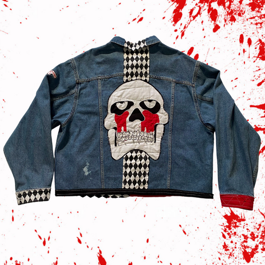 Unapologetic Youth Torn large/XL denim jacket with distressed details and classic fit, shown hanging on a wooden background.