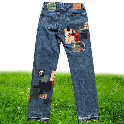 Unapologetic Youth Peaceful Cowboy 32x32 jeans showing distressed denim and classic cowboy stitching detail.