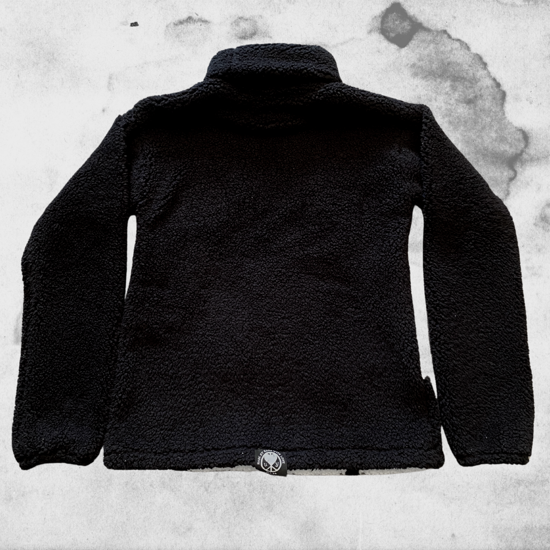 Unapologetic Youth Spooky v1 fleece hoodie with dark, spooky design, soft fabric, and cozy fit, shown on a model.