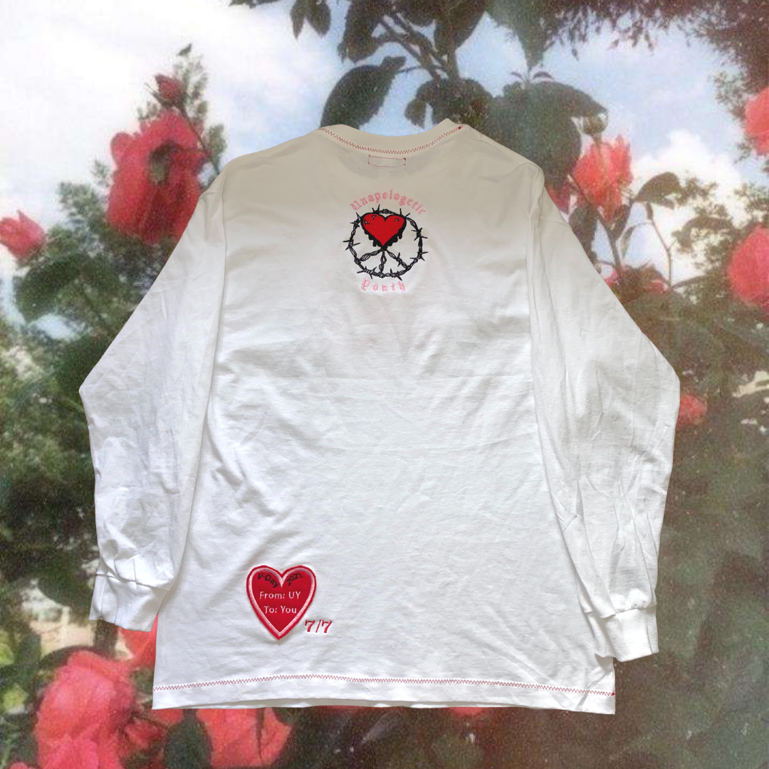 Unapologetic Youth Safe Place v2 long sleeve shirt in black, featuring bold graphic design on the front.