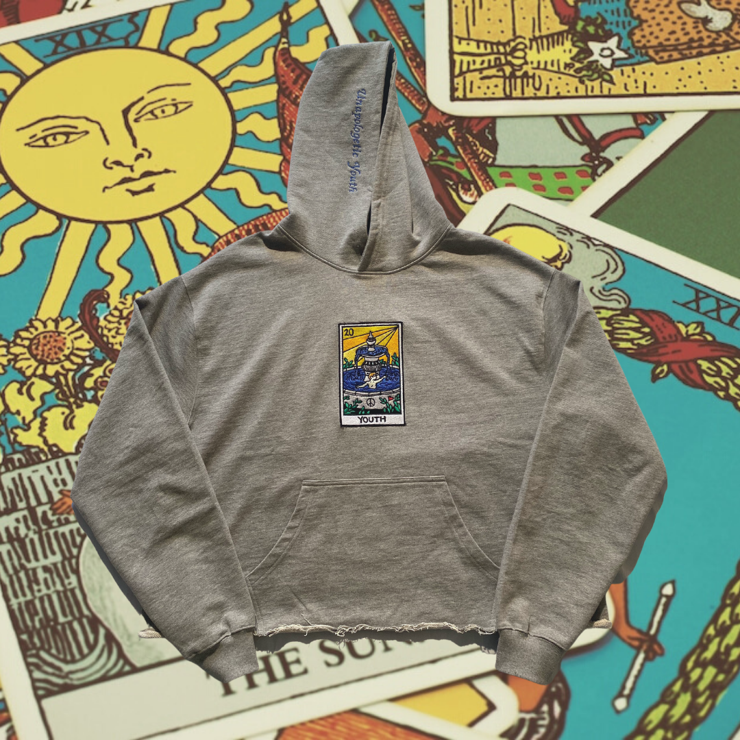 Unapologetic Youth Tarot Reader "Youth" hoodie featuring tarot card design, black hoodie with colorful printed artwork on front.
