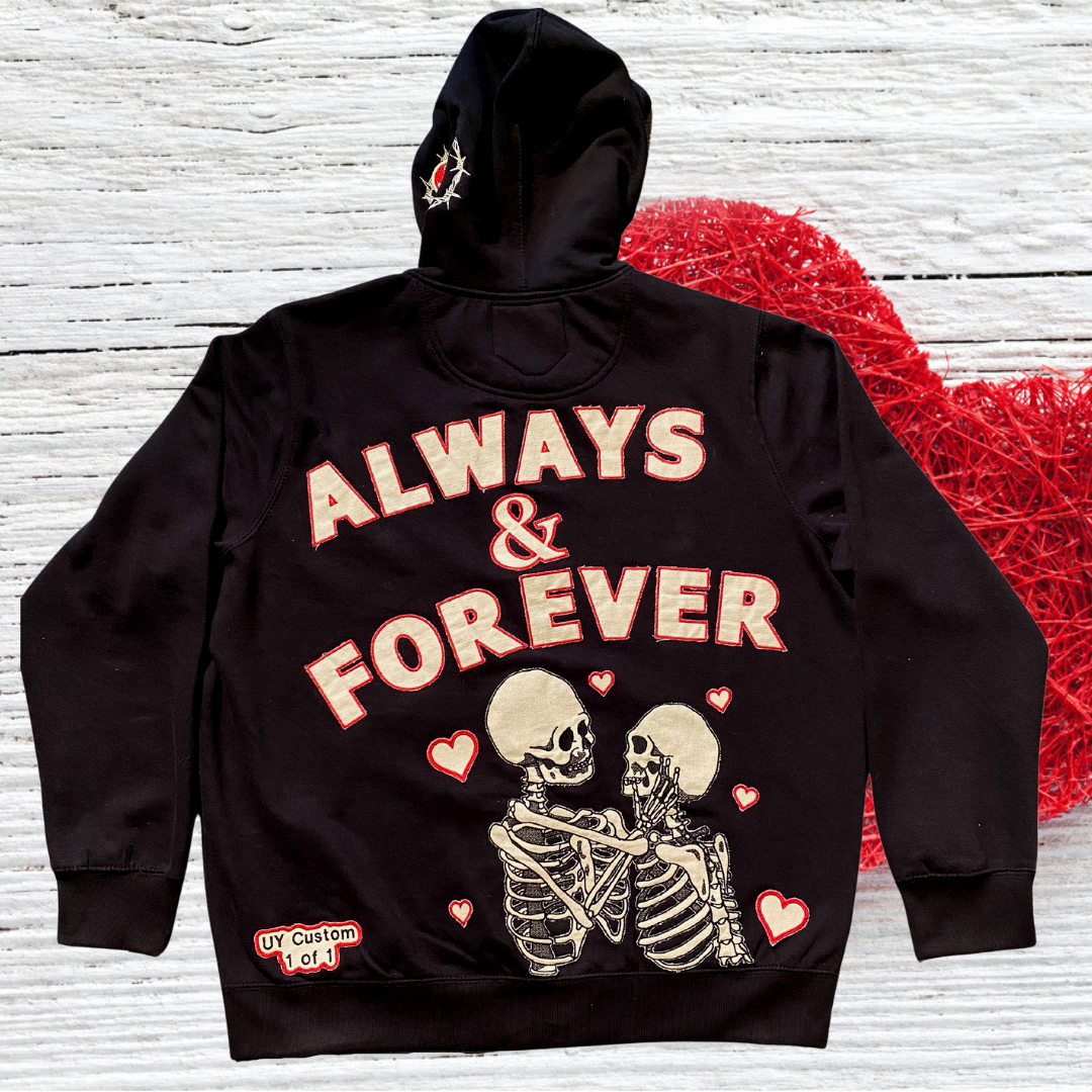 Unapologetic Youth Always & Forever large zip-up hoodie in black, featuring front pockets and a hood with drawstrings.