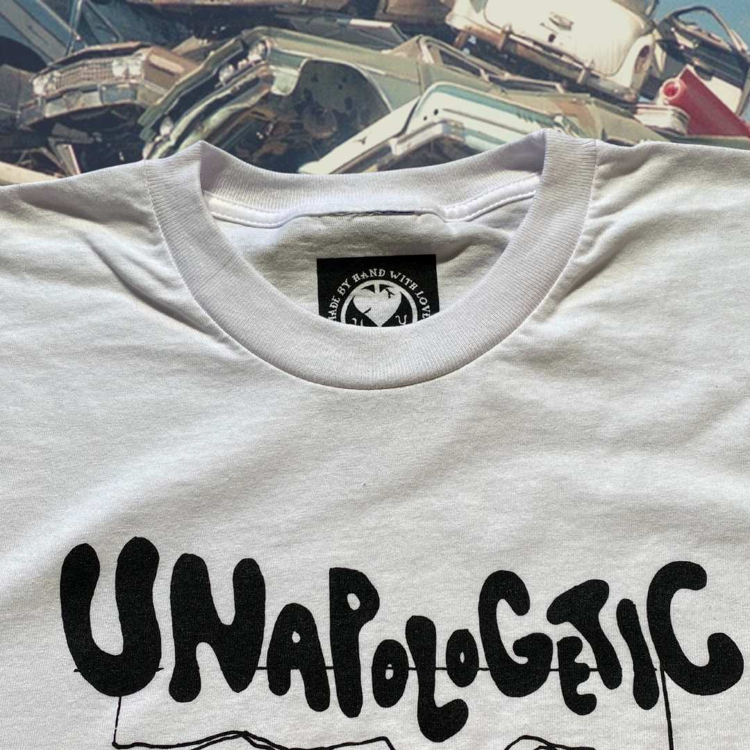 Unapologetic Youth Junkyard T-shirt featuring a bold graphic design on a comfortable black cotton shirt.