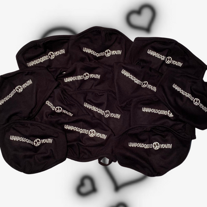 Unapologetic Youth Corona Killers facemask with bold design and logo, made of breathable fabric for comfortable protection.