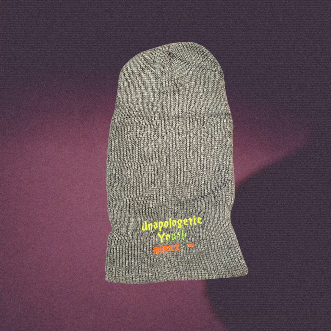 Unapologetic Youth Lick Hitter ski mask in black, close-up view showing the fabric and design details.