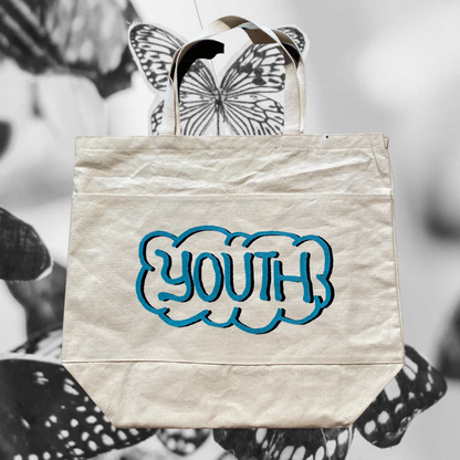 Unapologetic Youth Mother Nature tote bag featuring a nature-inspired design with earthy tones and eco-friendly style.