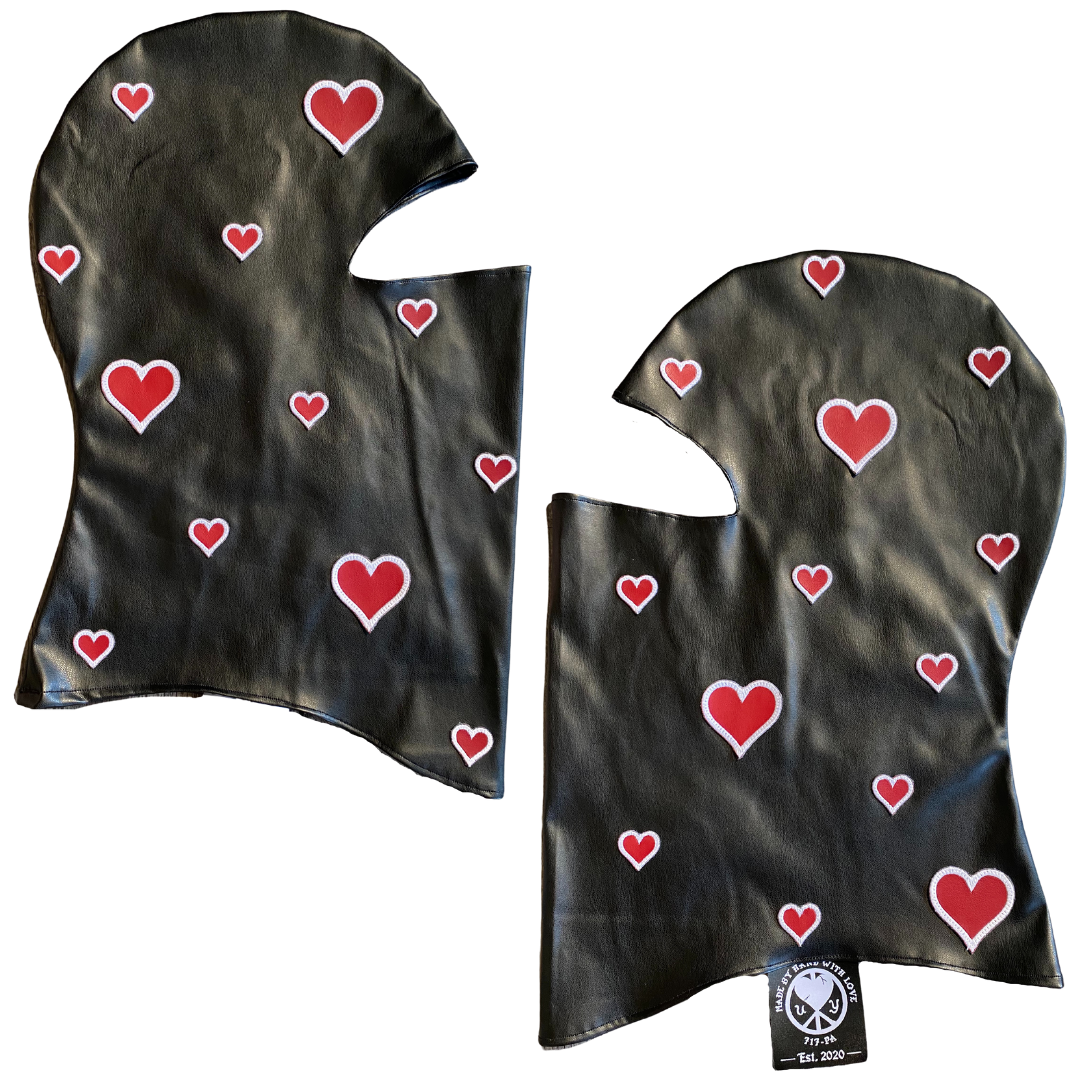 Unapologetic Youth balaclava in black, close-up showing snug fit and stretchy fabric for warmth and comfort.