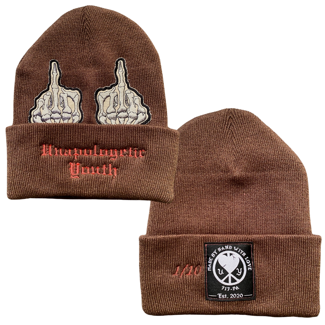 Unapologetic Youth middle finger beanie with bold graphic design, cozy knit fabric, and casual streetwear style.