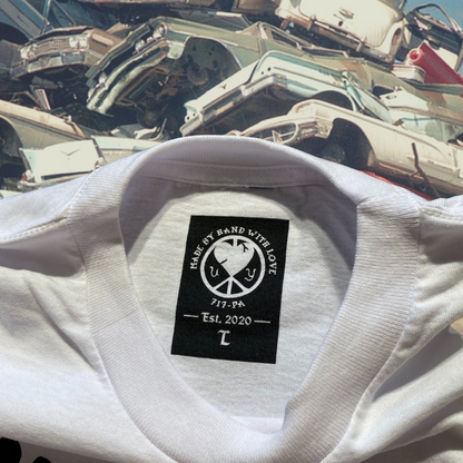 Unapologetic Youth Junkyard T-Shirt featuring bold graphic print on a casual black cotton tee.