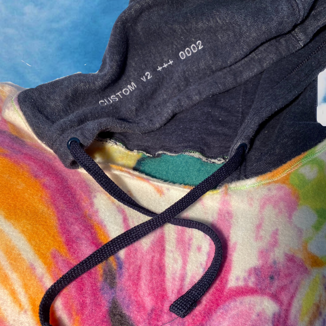 Unapologetic Youth hoodie in black with front pocket and drawstring hood, casual streetwear style.