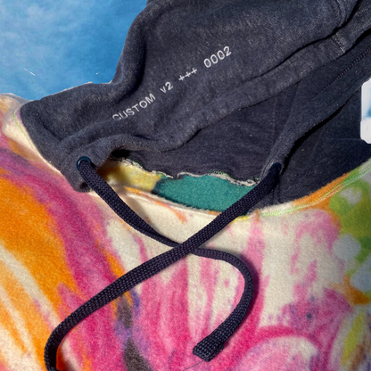 Unapologetic Youth hoodie in black with front pocket and drawstring hood, casual streetwear style.