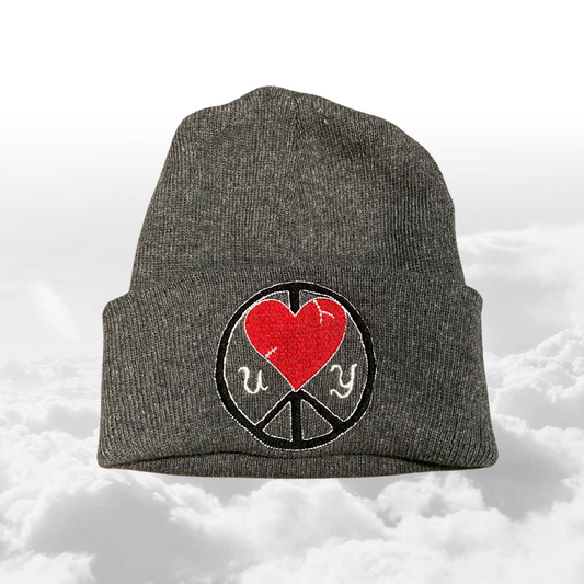 Unapologetic Youth UY Logo Beanie in black with white embroidered brand logo, cozy knit winter hat for cold weather.