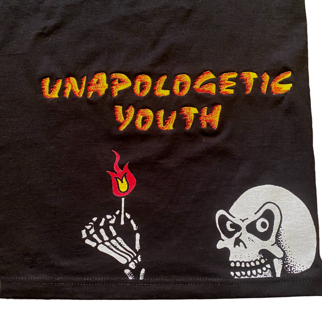 Unapologetic Youth long sleeve shirt featuring bold "Ignite The Flame" graphic design on soft fabric.