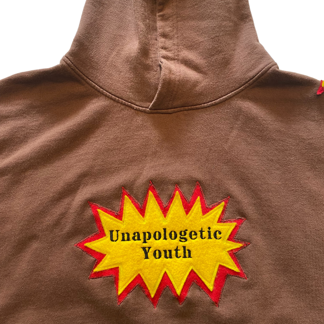 Unapologetic Youth War Torn hoodie featuring a distressed graphic design and casual fit, shown in a front view.