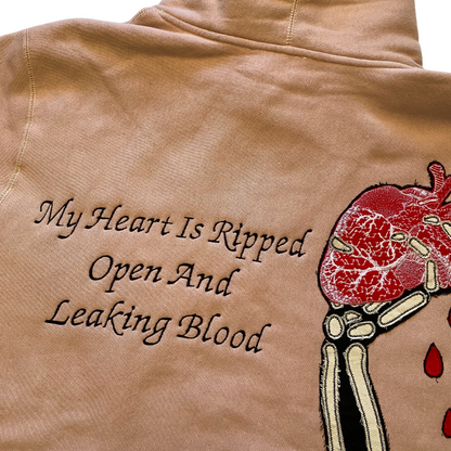 Unapologetic Youth Bleeding Love hoodie in black with bold graphic design and comfortable cotton fabric.