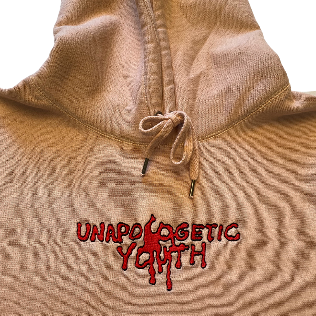 Unapologetic Youth Bleeding Love hoodie featuring a bold graphic design and comfortable fit, displayed on a model.