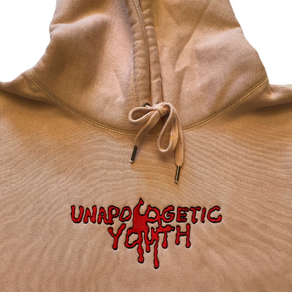 Unapologetic Youth Bleeding Love hoodie featuring a bold graphic design and comfortable fit, displayed on a model.