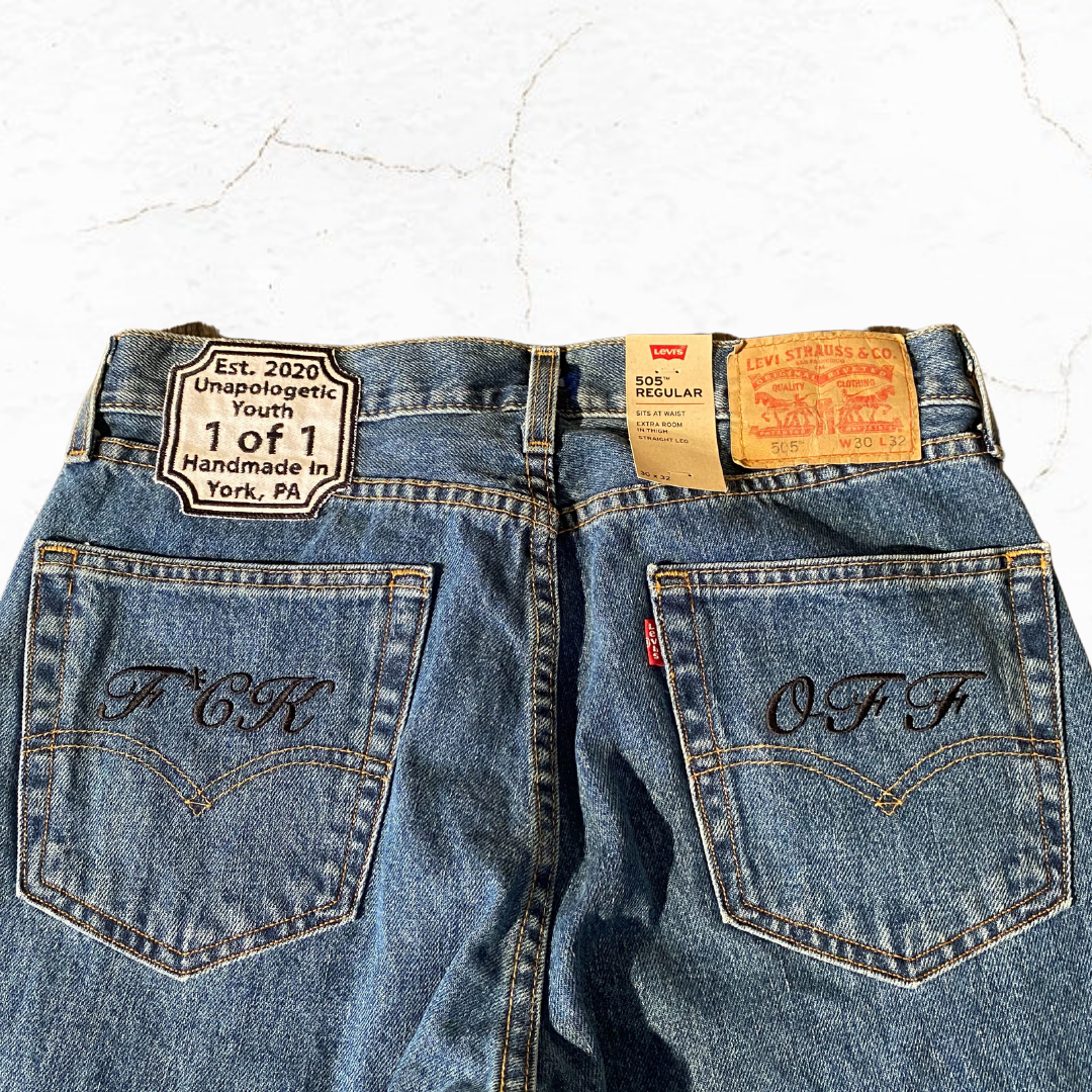 Unapologetic Youth "To The Bone" 1/1 jeans, showcasing distressed denim with a slim fit and stylish design.