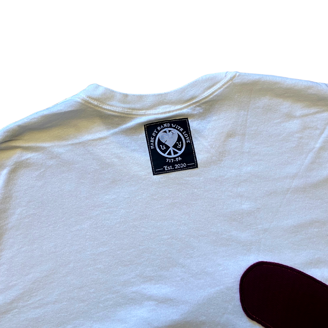 Unapologetic Youth Waves T-Shirt with a vibrant wave graphic on a casual cotton tee.