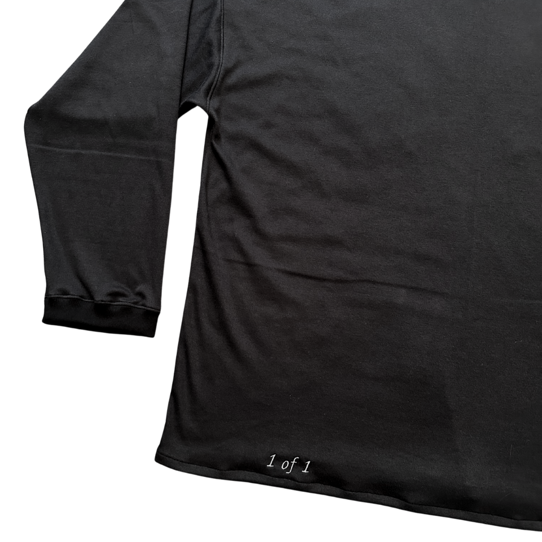 Unapologetic Youth long sleeve Bones shirt featuring a stylish bone graphic design on a black fabric background.