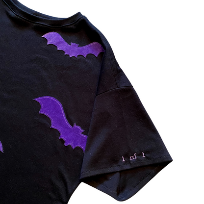 Unapologetic Youth Spooky V2 T-shirt featuring spooky graphic design on black fabric, casual and stylish for Halloween-themed wear.