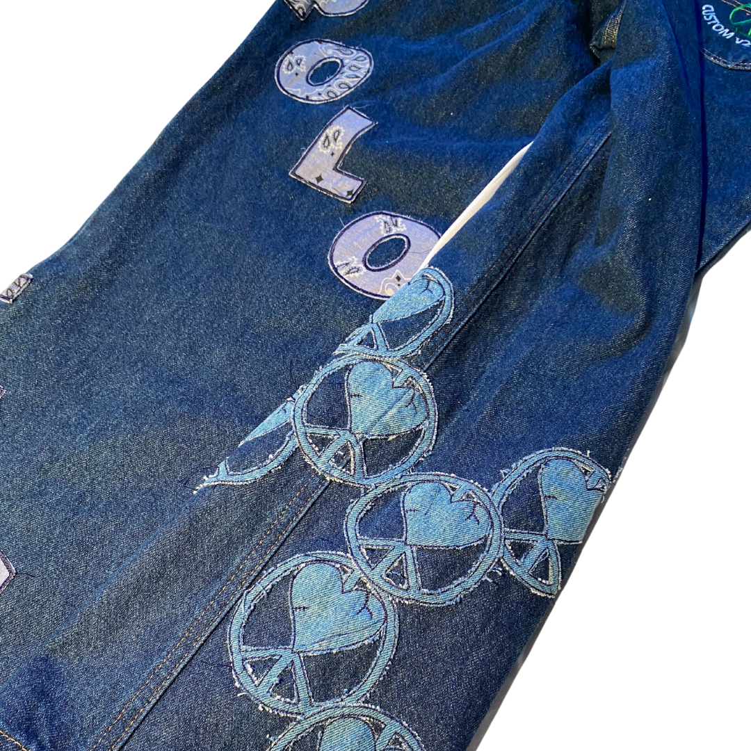 Unapologetic Youth jeans in classic denim, featuring a slim fit design and visible stitching, displayed on a neutral background.