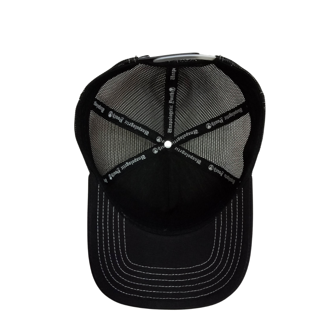 Unapologetic Youth Hearts trucker hat featuring a bold heart graphic on the front, casual adjustable cap style.