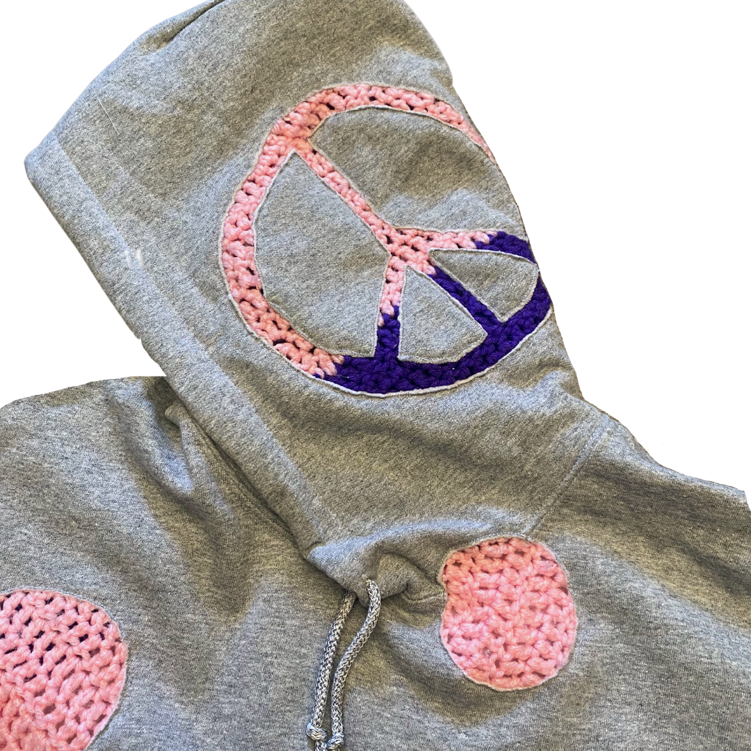 Unapologetic Youth Grandma's Crochet hoodie in black with colorful embroidered floral design, soft and cozy casual wear.