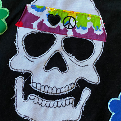 Unapologetic Youth Hippie Dreams hoodie displayed on a hanger, featuring colorful, bohemian-inspired design and soft fabric.