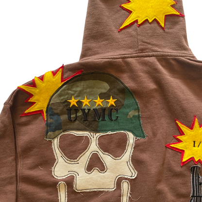 Unapologetic Youth War Torn hoodie featuring distressed fabric and bold graphic design on the front.