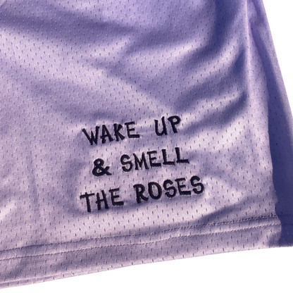 Unapologetic Youth Rose City shorts in vibrant pink with casual fit, displayed on a hanger.