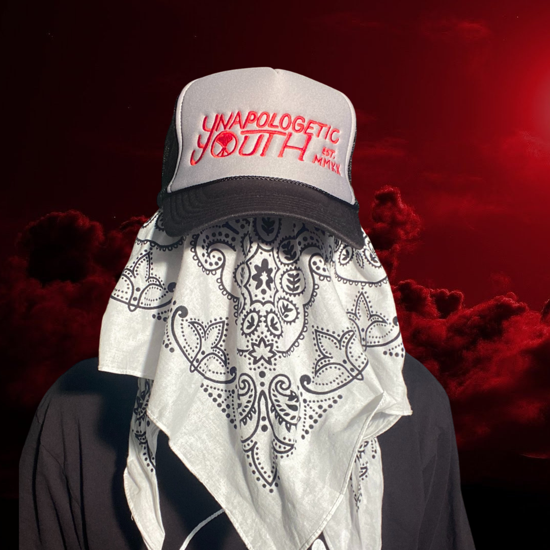 Unapologetic Youth logo trucker hat with adjustable mesh back and structured front panel featuring bold logo design.