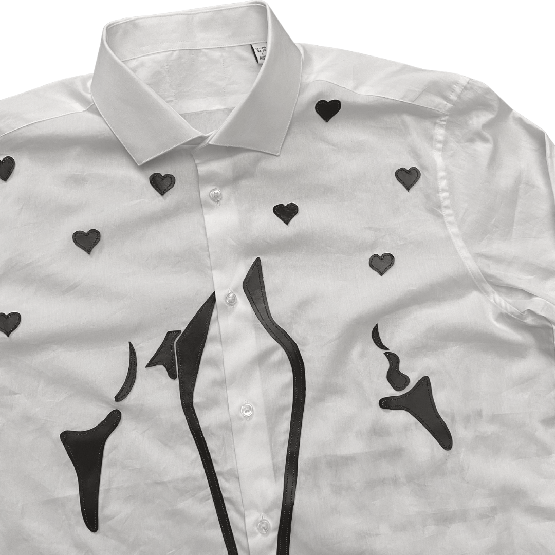 Unapologetic Youth button-down shirt featuring a vibrant faces print, casual fit, and classic collar design.