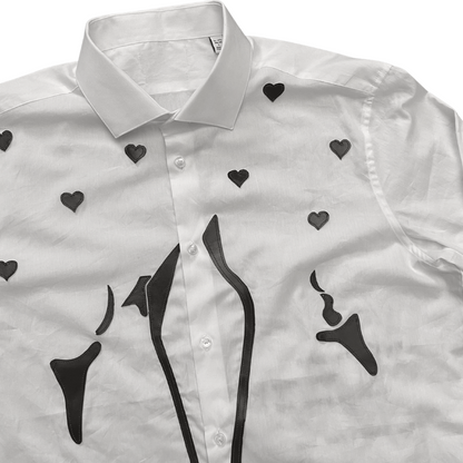 Unapologetic Youth button-down shirt featuring a vibrant faces print, casual fit, and classic collar design.
