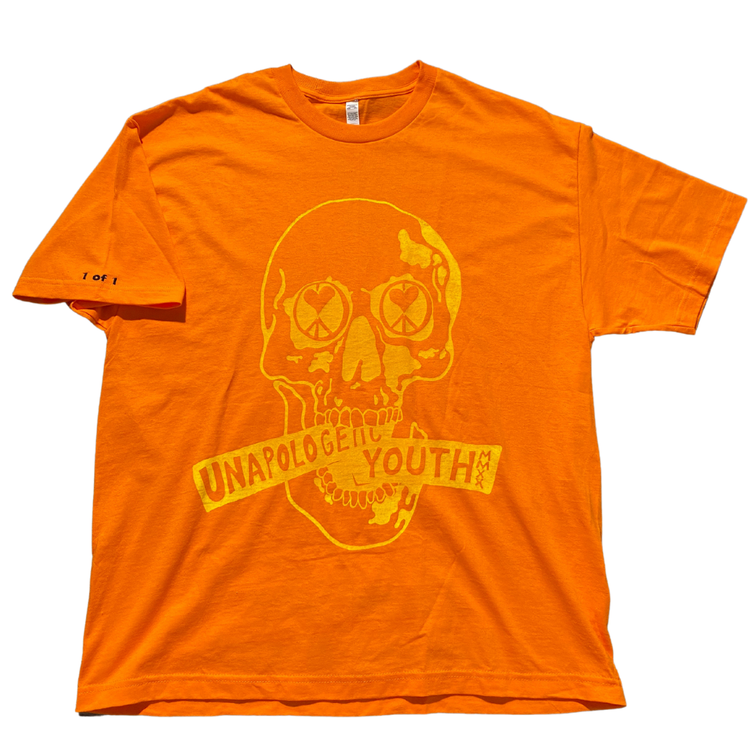 Unapologetic Youth orange T-shirt with bold graphic design, displayed flat on a white background.
