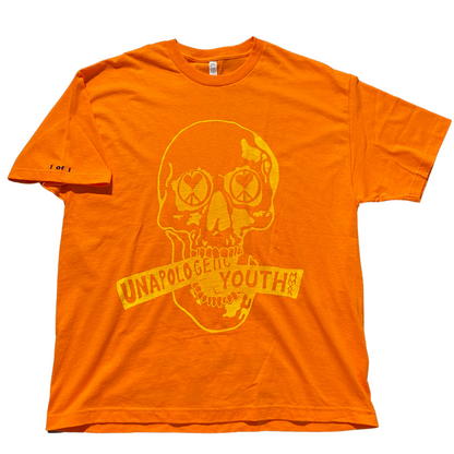 Unapologetic Youth orange T-shirt with bold graphic design, displayed flat on a white background.