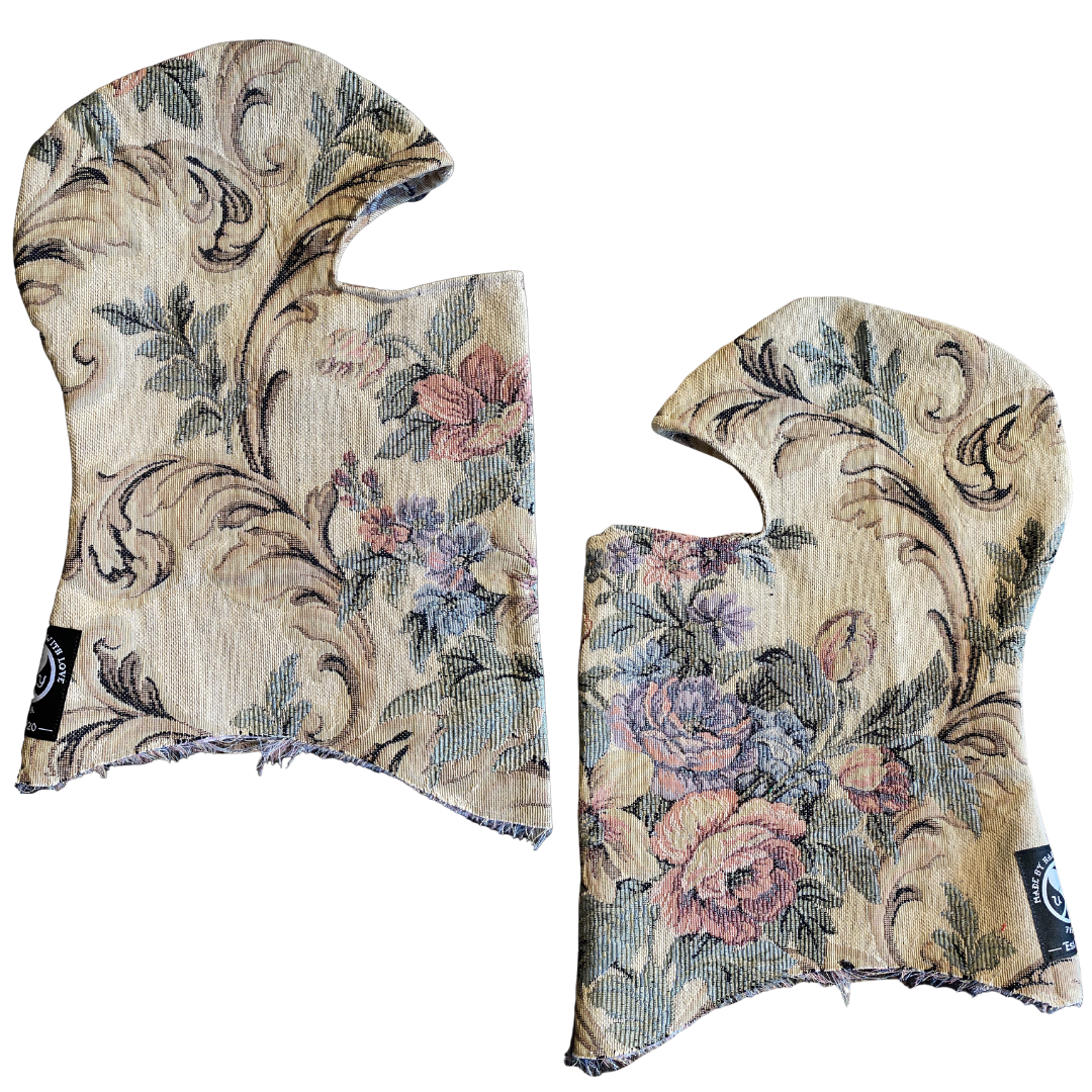 Black Unapologetic Youth balaclava covering the head and face, made of stretchy fabric for warmth and full facial coverage.