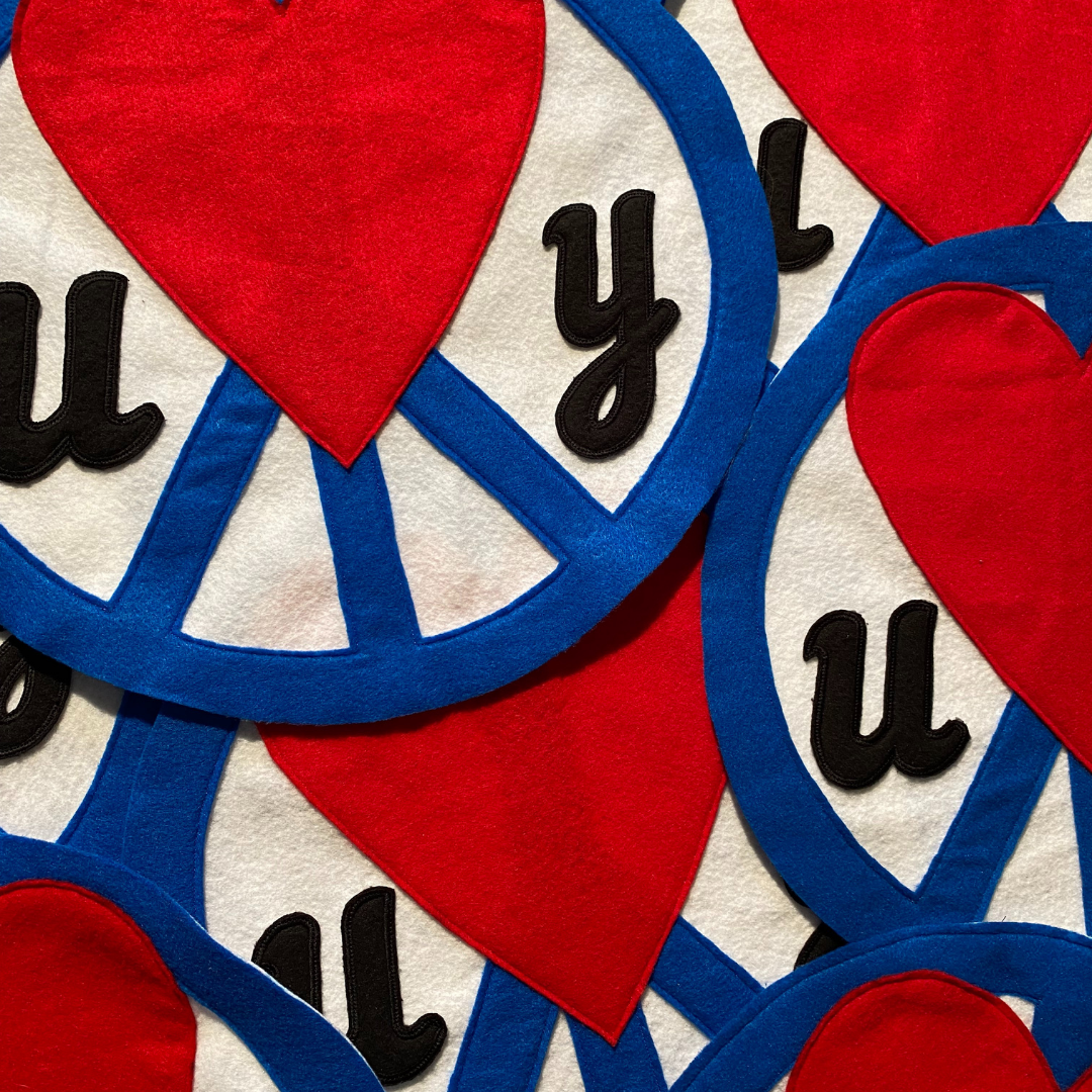 Unapologetic Youth Split Logo sweatpants with black and white design, casual fit, and logo detail on the leg.