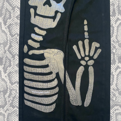 Unapologetic Youth "To The Bone" 1/1 denim jeans with distressed details and classic fit, displayed on a neutral background.