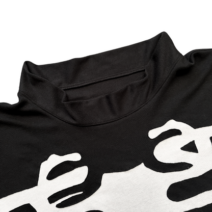 Unapologetic Youth long sleeve bones graphic t-shirt, black with white bone design, casual streetwear top for everyday wear