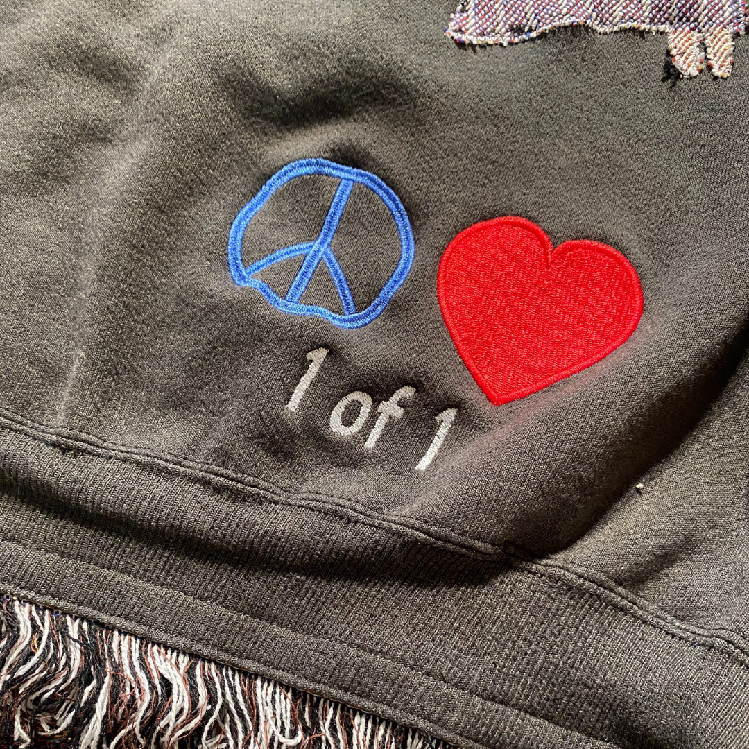 Unapologetic Youth My Dear Friends crewneck or poncho with colorful floral pattern on dark fabric, casual and cozy style.