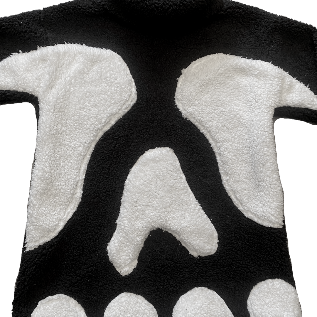 Unapologetic Youth Spooky V1 fleece hoodie with dark, spooky design, soft fabric, and hooded style for a cozy, stylish look.