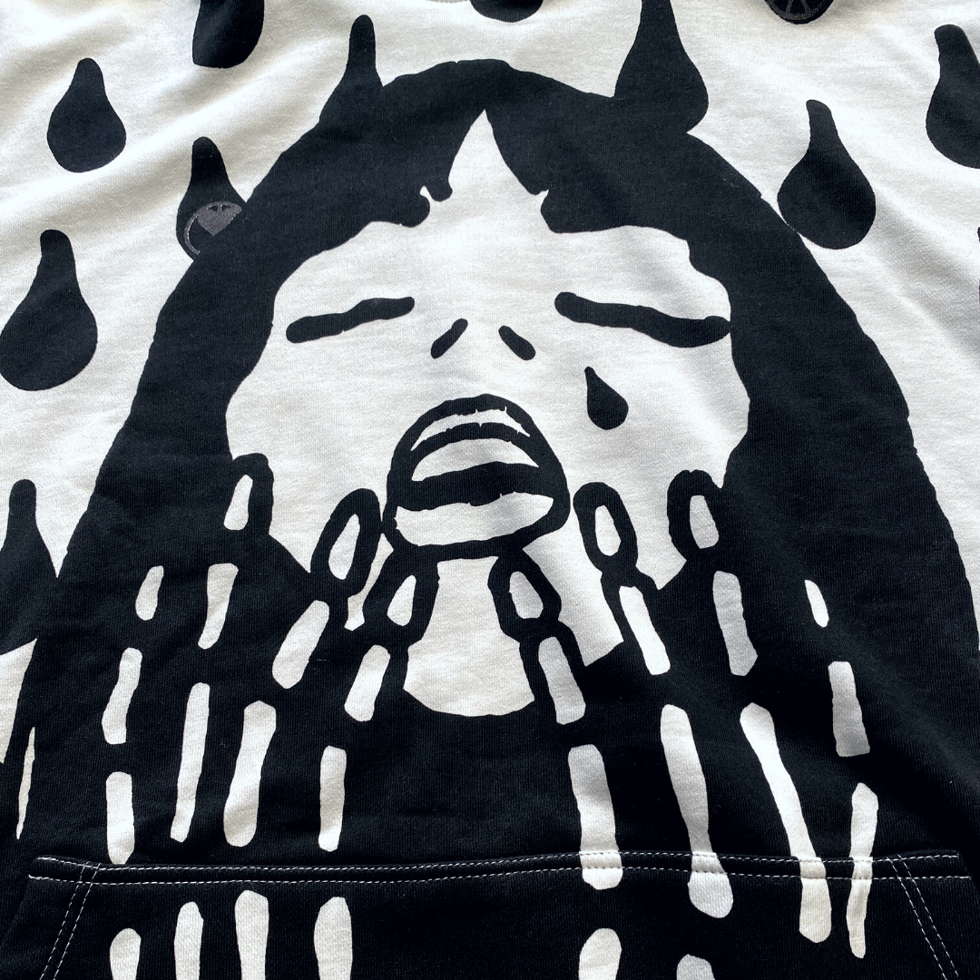 Unapologetic Youth Rain On My Skin hoodie featuring a rain-themed graphic design on soft black fabric.