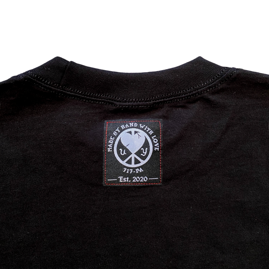 Unapologetic Youth long sleeve shirt titled "Ignite The Flame" featuring bold flame graphic design on black fabric