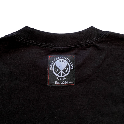 Unapologetic Youth long sleeve shirt titled "Ignite The Flame" featuring bold flame graphic design on black fabric