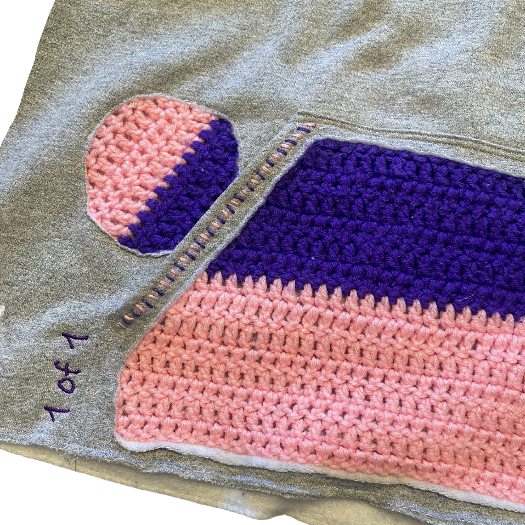 Unapologetic Youth Grandma's Crochet hoodie in gray with front pocket and hood, casual streetwear style.