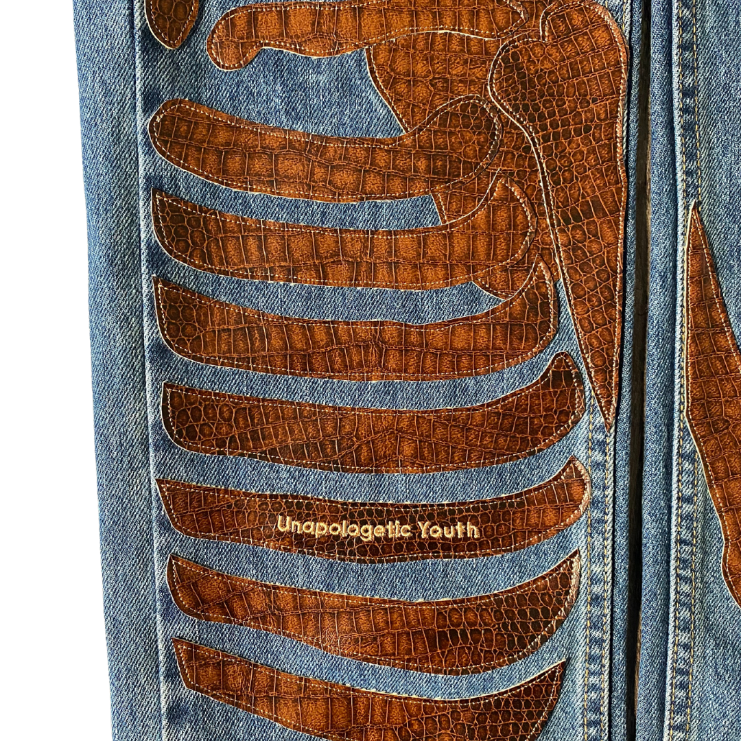 Unapologetic Youth "To The Bone" jeans in 1/1 fit, showcasing distressed denim with frayed edges and a relaxed, stylish silhouette.