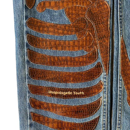 Unapologetic Youth "To The Bone" jeans in 1/1 fit, showcasing distressed denim with frayed edges and a relaxed, stylish silhouette.