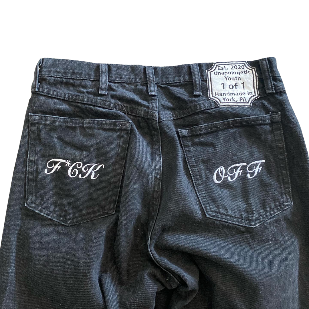 Black denim jeans from Unapologetic Youth x Levi's "To The Bone" collection, featuring classic fit and detailed stitching.